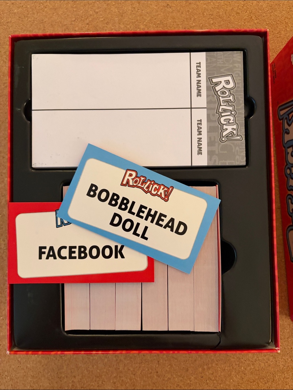 Rollick! Party Game by — Red Box with Blue, Yellow & Green Masks - Picture 3 of 6